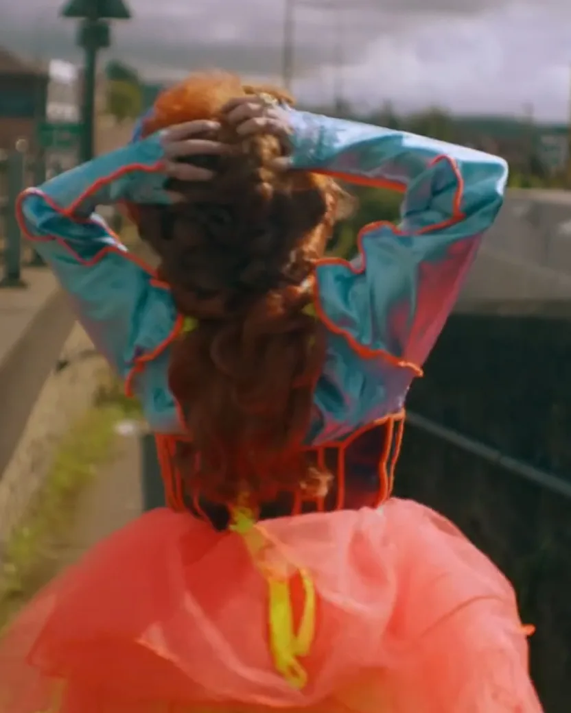 The back of a woman in a colorful dress